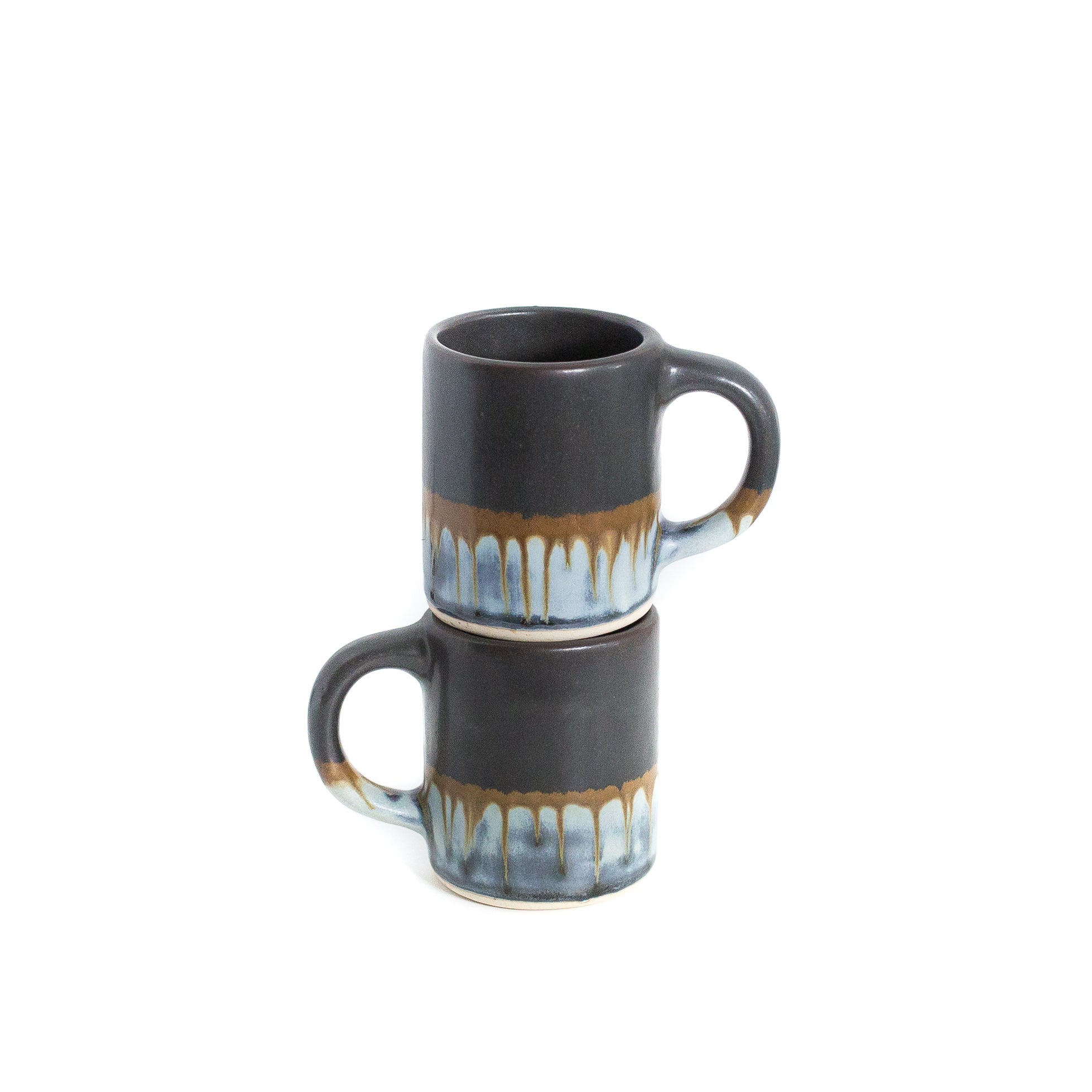 stacked multi colour coffee mugs