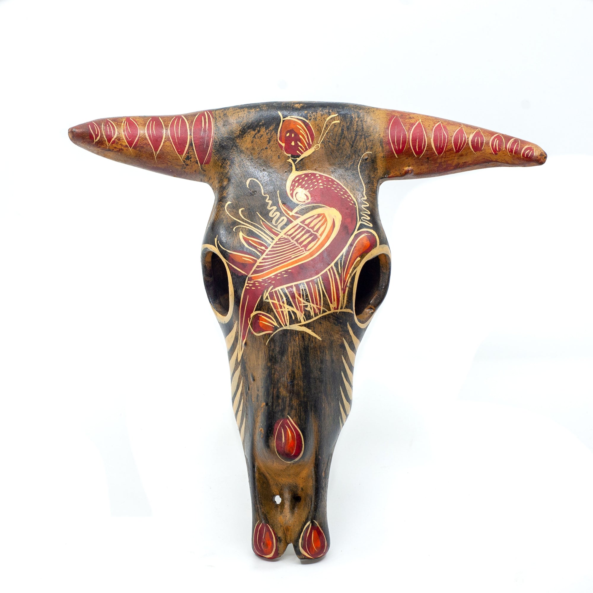 Photo of medium terracotta cow skull with handpainted designs