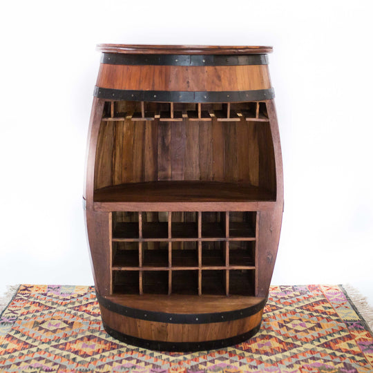 Photo of a teak wood barrel table with room for wine bottles and glasses.