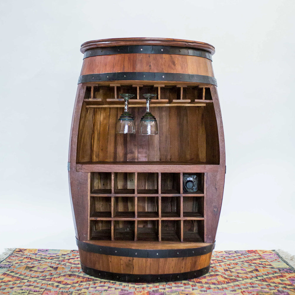 Photo of a teak wood barrel table with room for wine bottles and glasses.