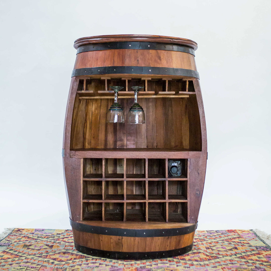 Photo of a teak wood barrel table with room for wine bottles and glasses.