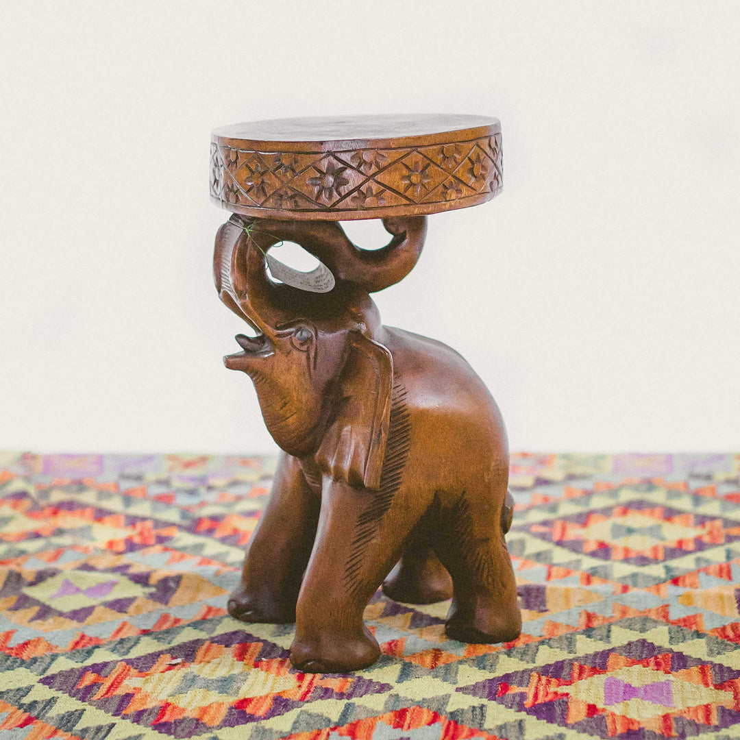 Photo of carved standing elephant with a small table top