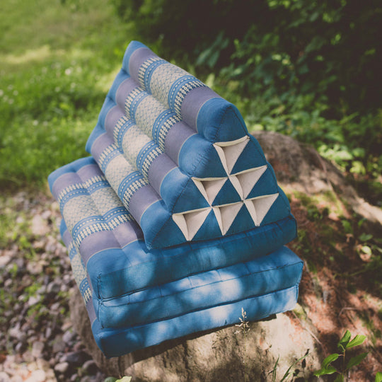Photo of a folding yoga cushion in various positions, a blue colour and a green colour