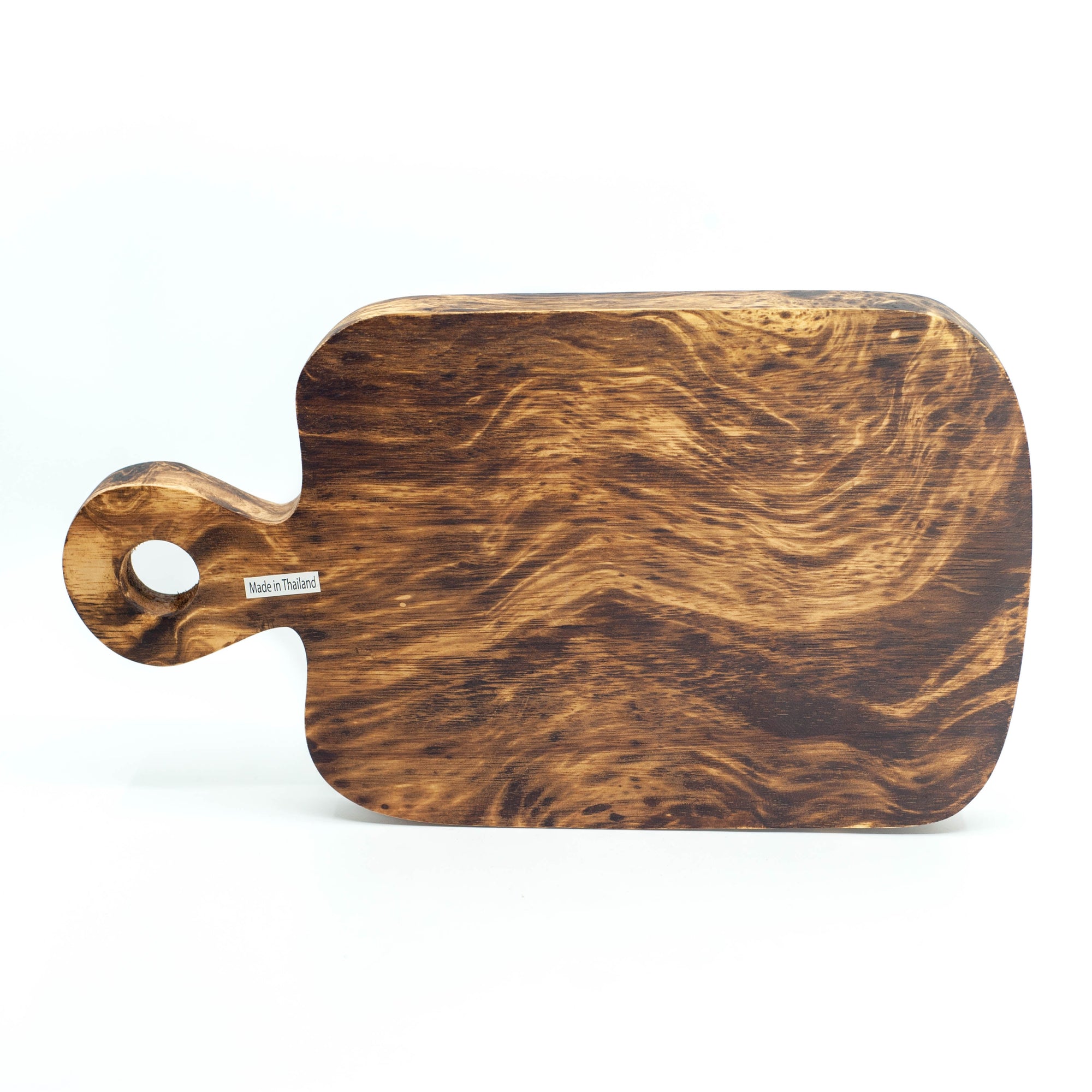 Photo of a mango wood cutting board in various colours featuring a dip dyed pattern